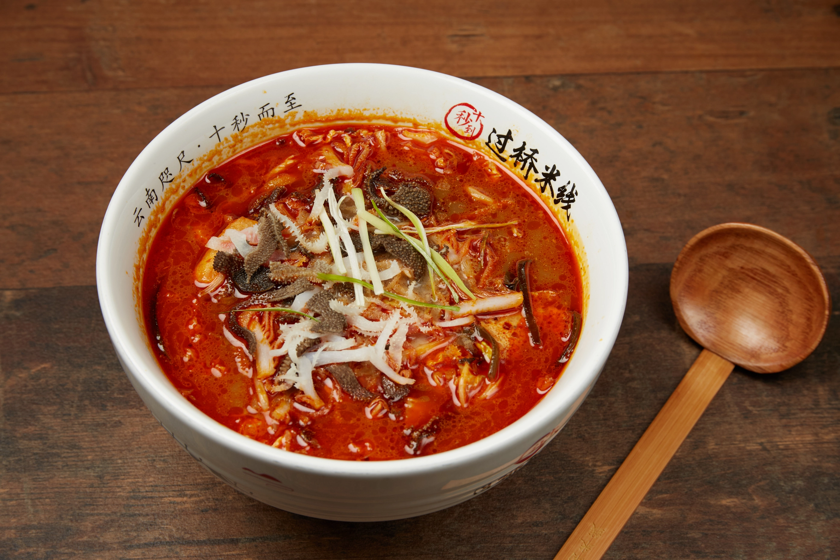 Fresh hot pot ingredients and sauces arranged for the table